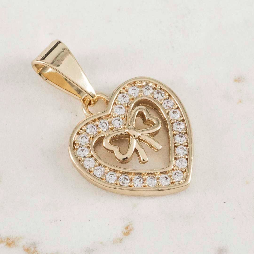 DIJE CORAZON MOÑO EN MEDIO CIRCONES