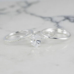 TRIO DE ANILOS SOLITARIO OVALO , LISO Y BANDA CIRCONES